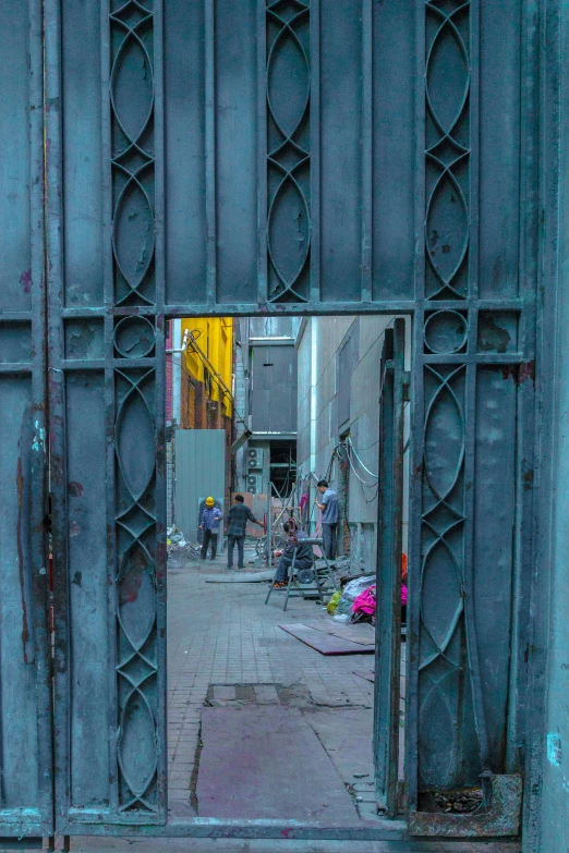 a large gray gate in front of a building