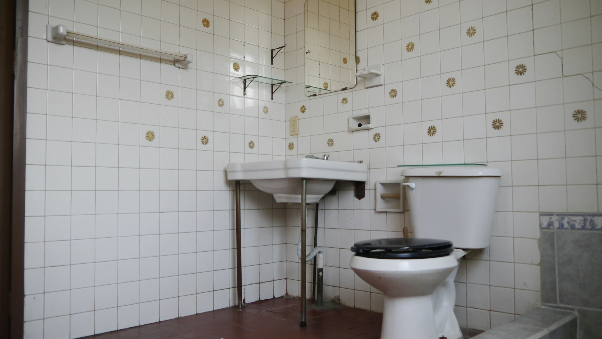 a bathroom with a white sink next to a toilet