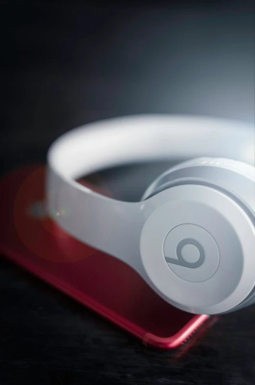 a pair of beats on top of a phone