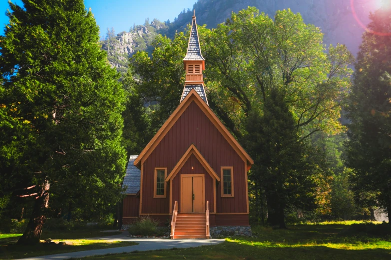 a little wooden church in a mountain setting