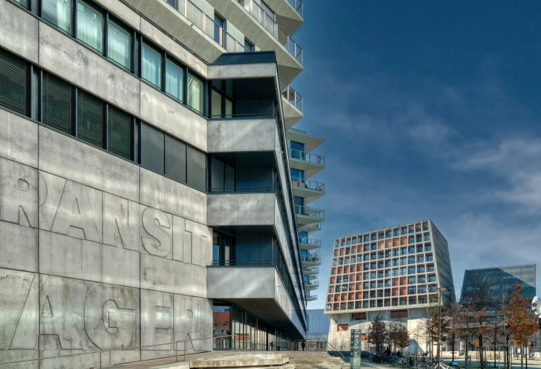 two concrete buildings and a paved roadway