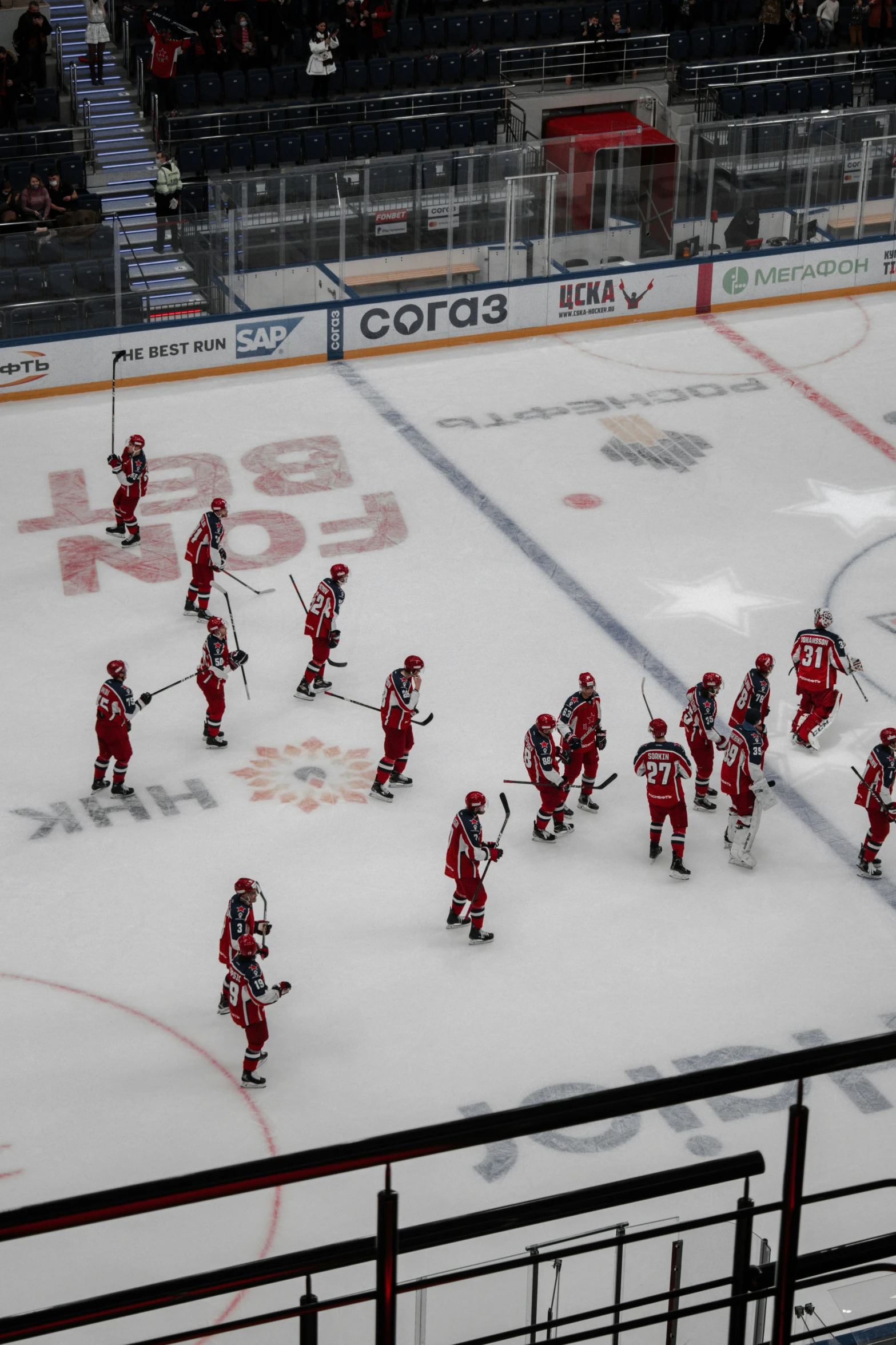 a group of hockey players playing on a rink