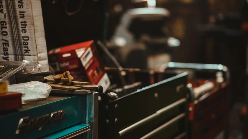 the wooden drawers in the room are full of old items