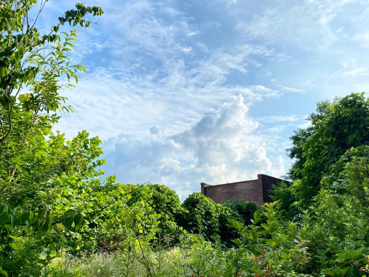 the sky is very bright and cloudy above a house