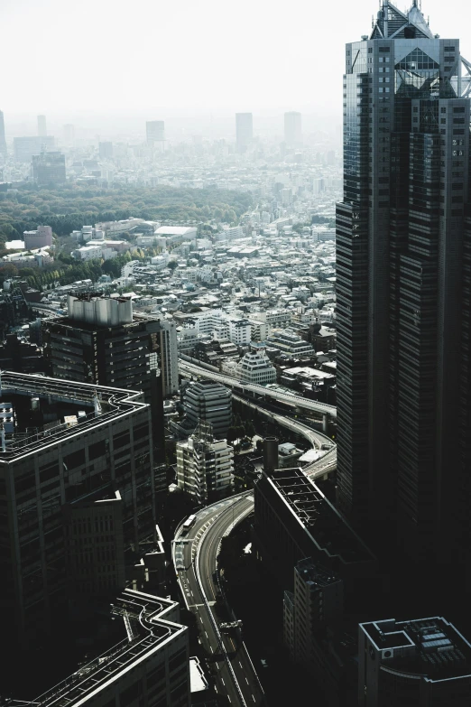 the view from the top of a tall building in an industrial area