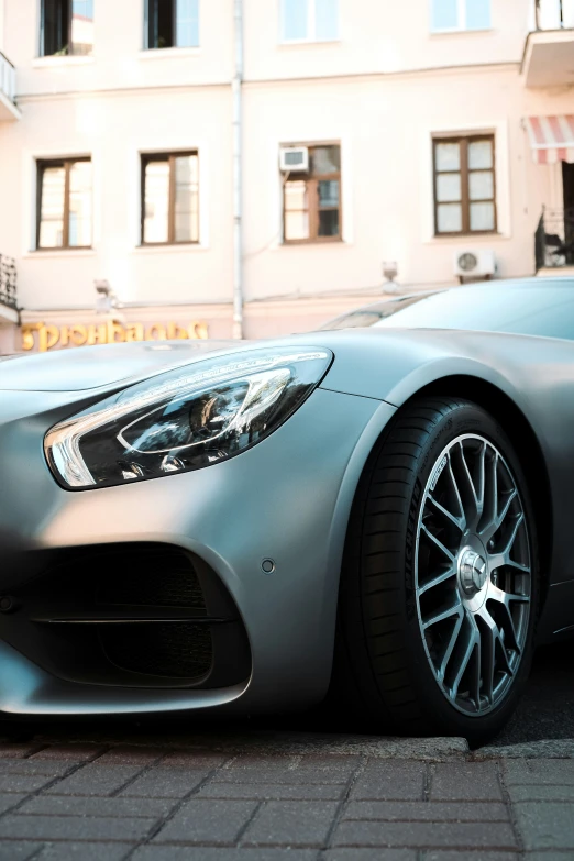 a car parked in front of a large building