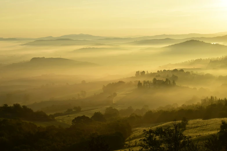 fog on a valley is rising in the mountains