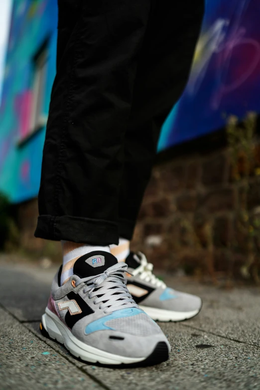 the feet of a person standing on the sidewalk