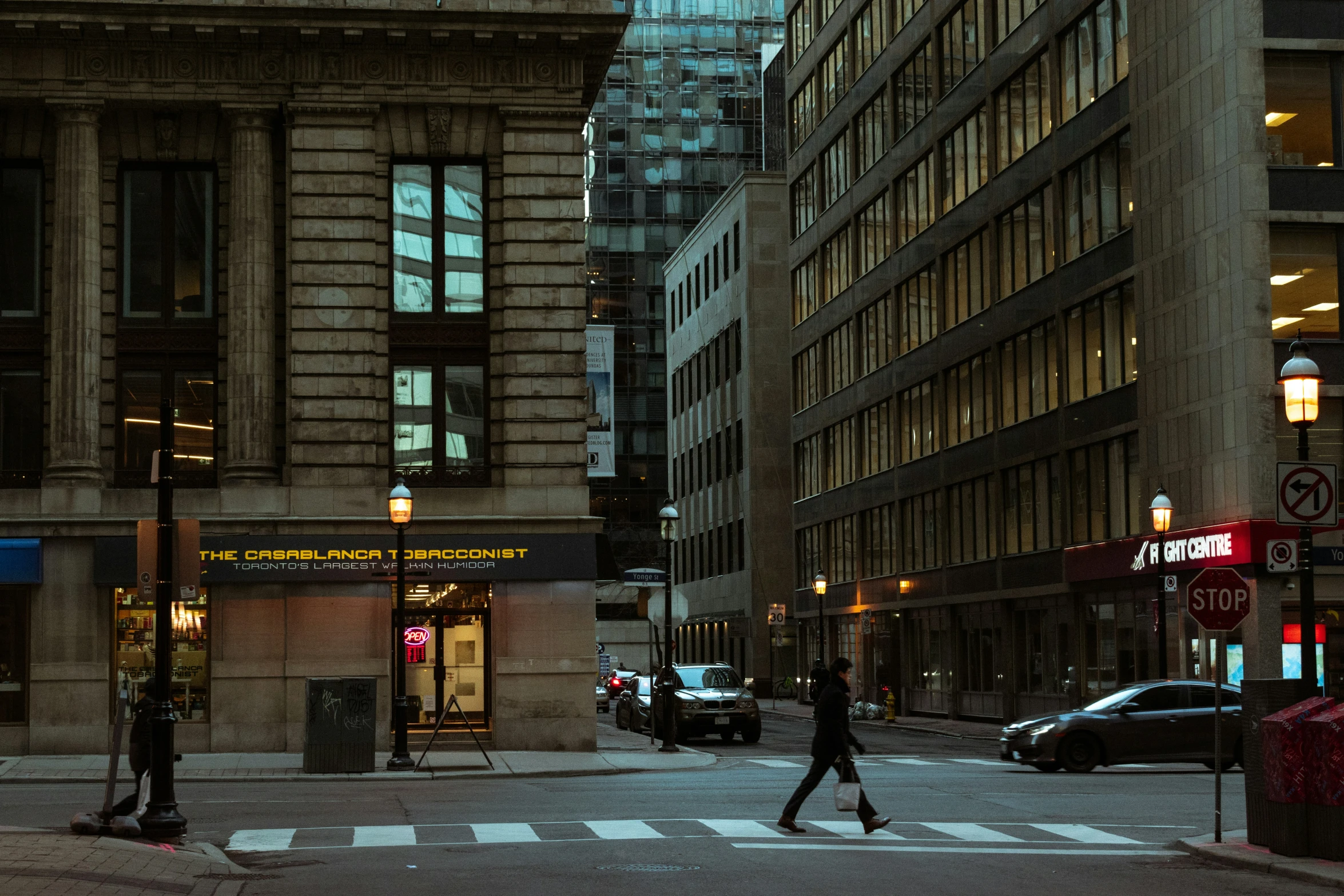 a city street filled with traffic and tall buildings