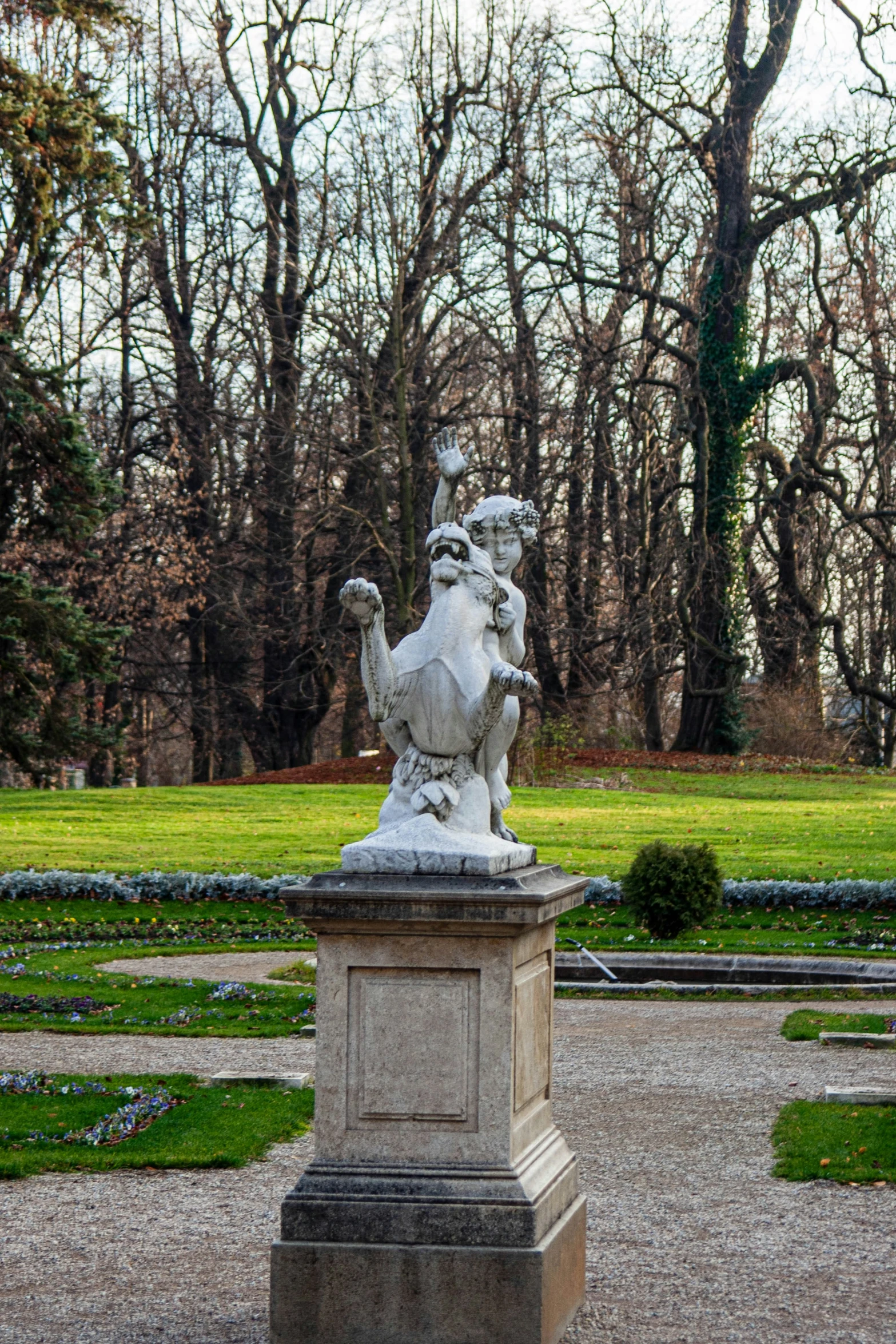 the statue is next to a park