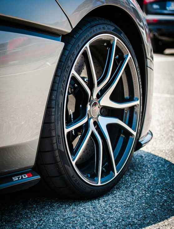 a very close up view of some big black wheels