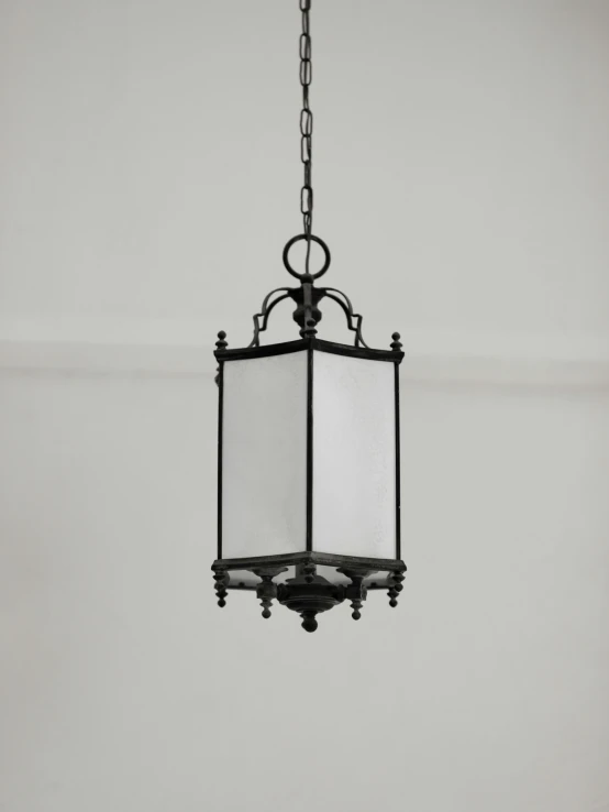 an outdoor hanging lantern is mounted to the ceiling