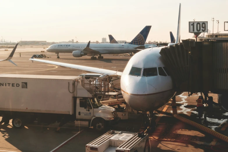 an airport with multiple jetliners sitting on the tarmac