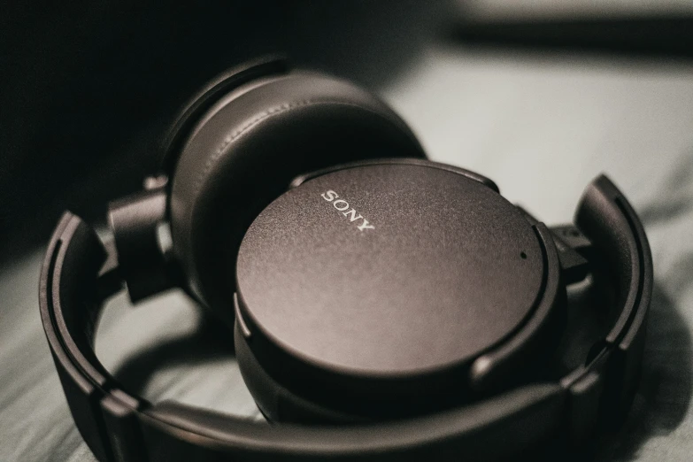 a close up view of a pair of headphones sitting on a surface