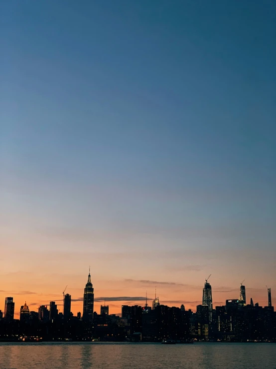 a beautiful cityscape at sunset with a clear sky