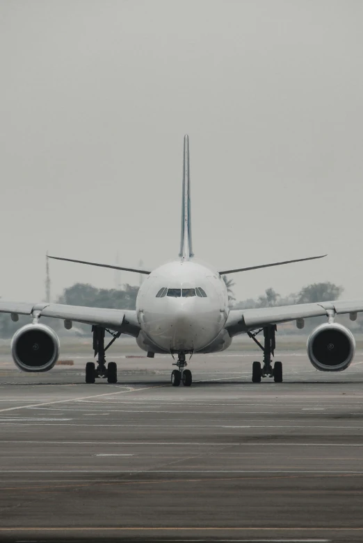 an airplane on a run way during the day