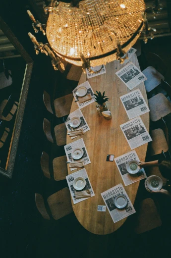a dining room table with place settings for plates and napkins