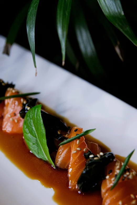 a plate of food with leaves on top