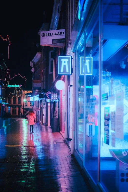 a person walking down a wet city street