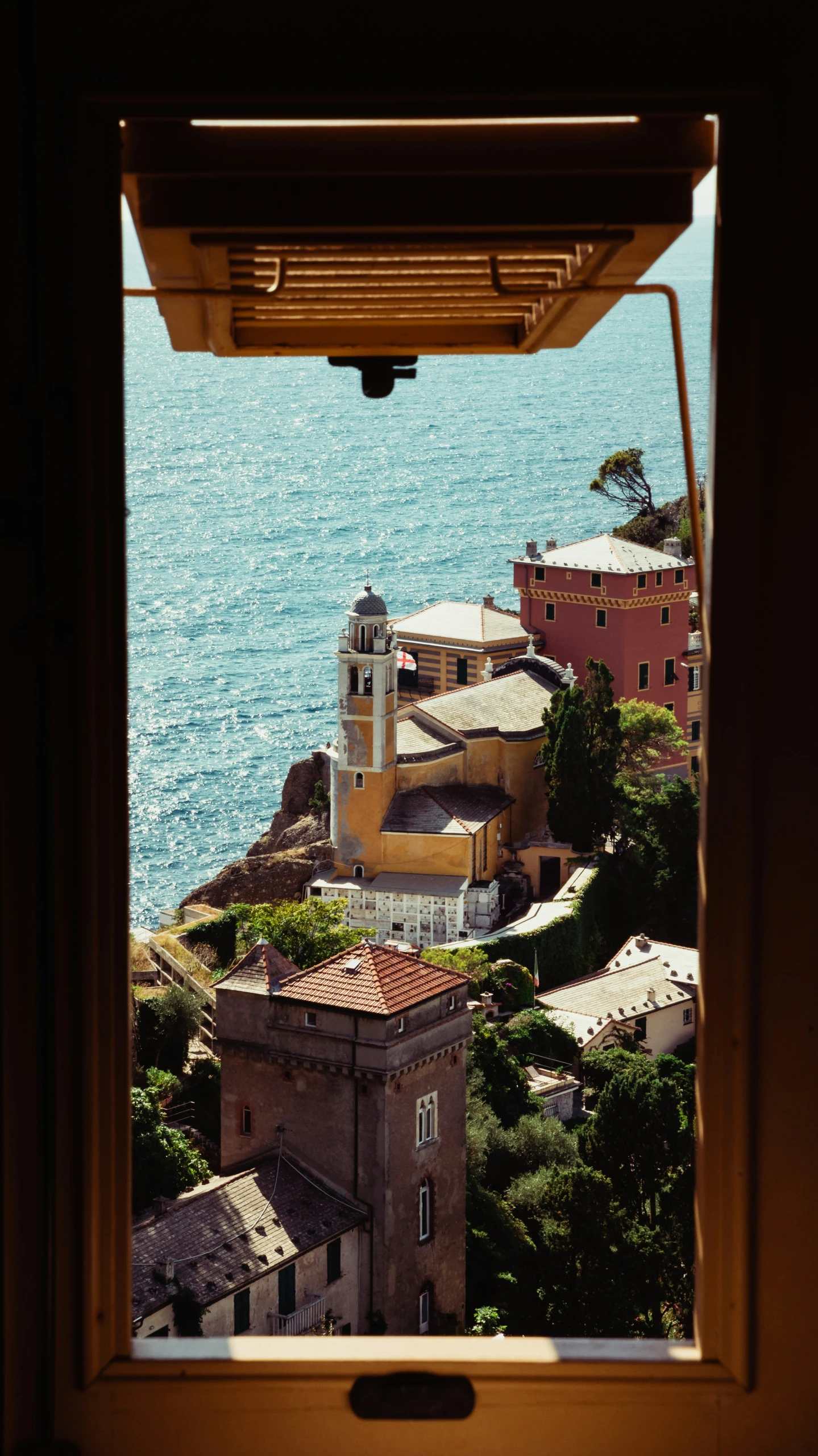 a city by the water from inside a window