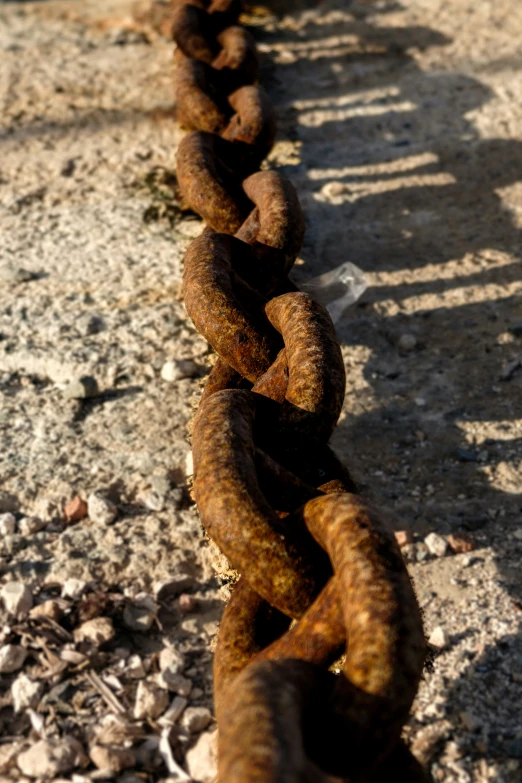 a very long chain attached to some concrete