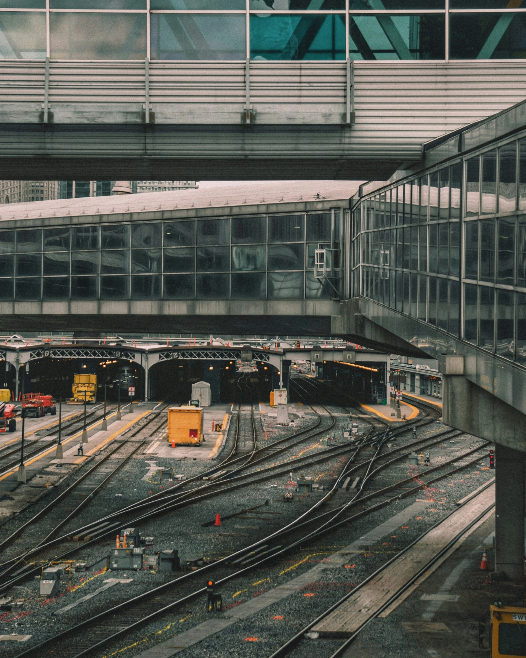 a train track with cars in it at a stop