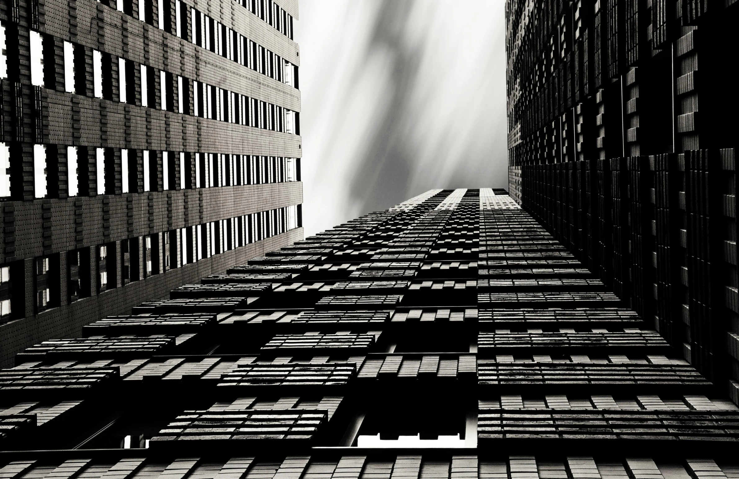 a dark image with some windows and some rain falling