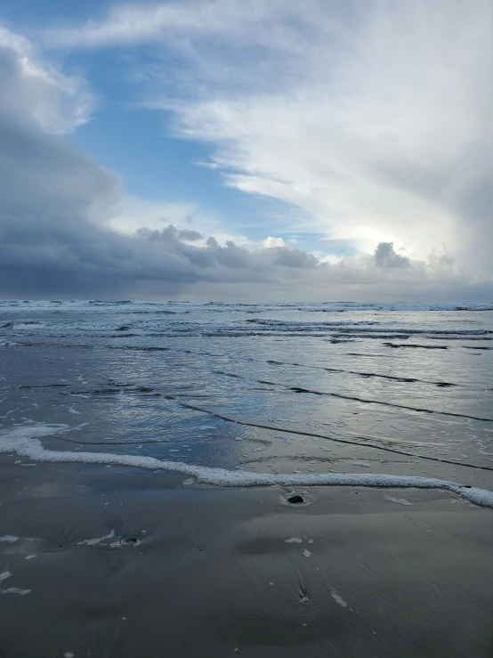 ocean and grey clouds rolling in from the shore