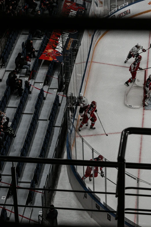 hockey players playing on the ice during a game