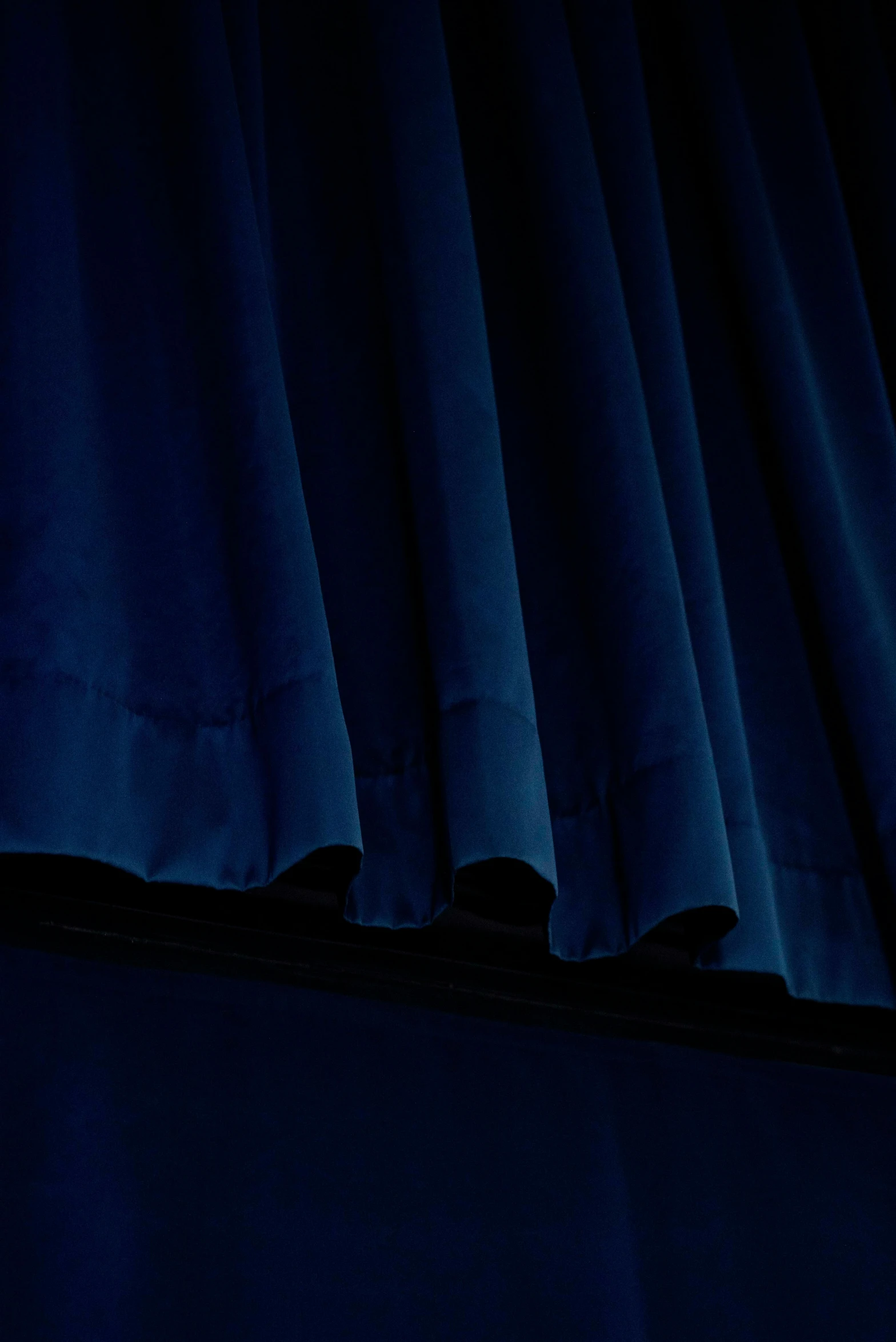 a close up s of a curtain in the dark