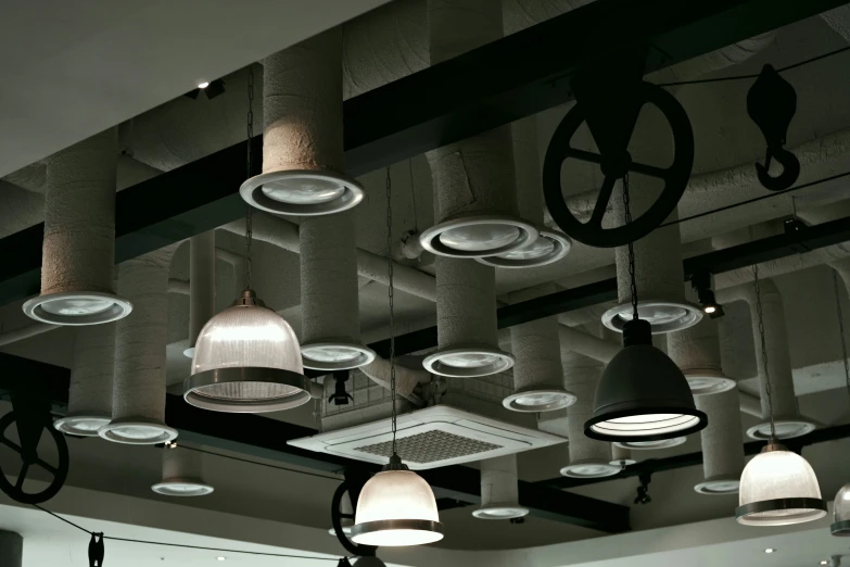 various lights that are on a ceiling in a building