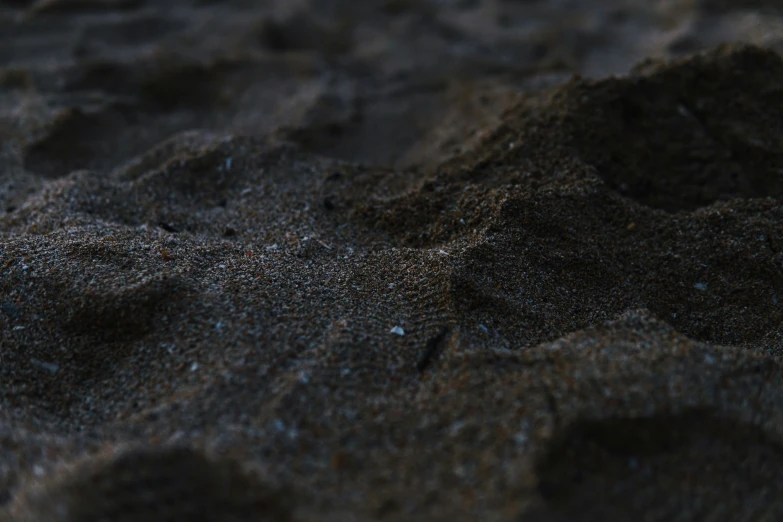 black sand on the beach in the evening