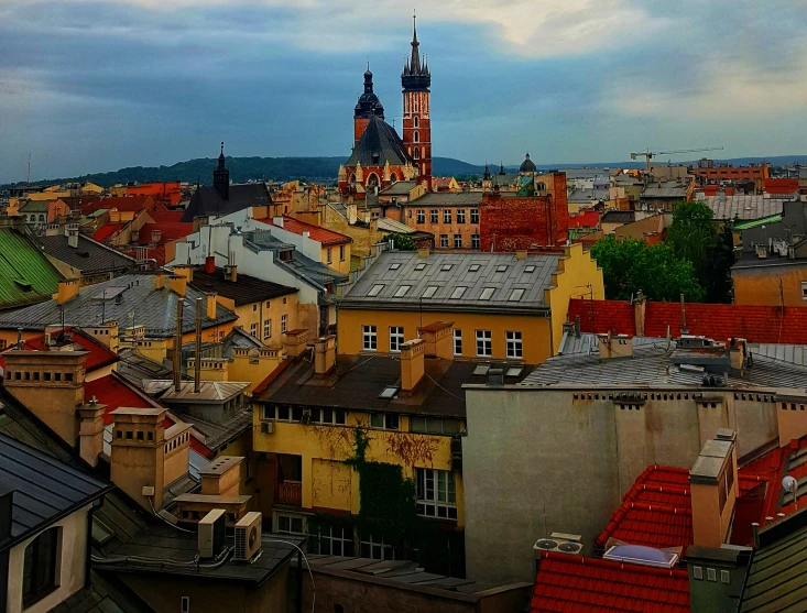 a view of the roof tops of old buildings