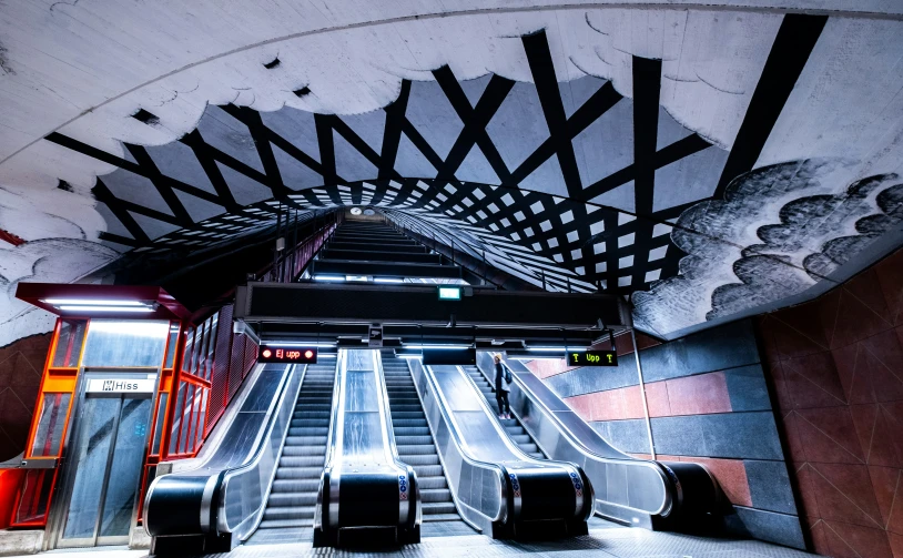 the escalator leads to several stairs leading up