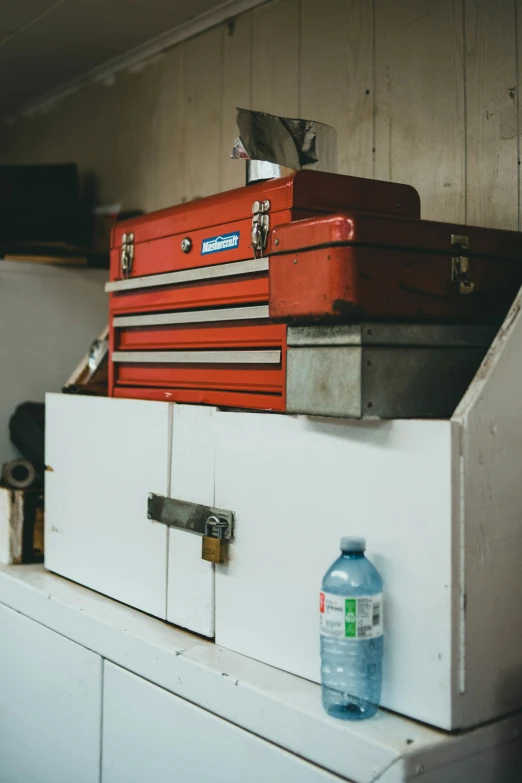 a stack of suitcases is stacked up with a container