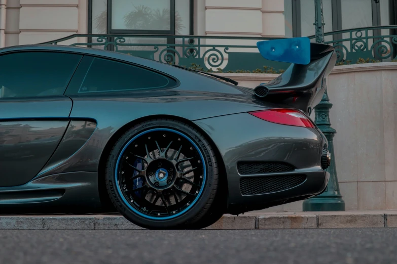 the front end of a sports car on the street