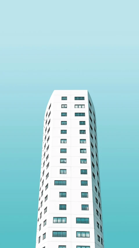 a tall white building with lots of windows