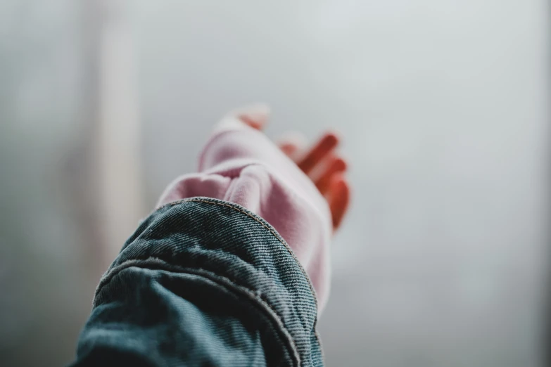 the backside view of a persons hand in the fog