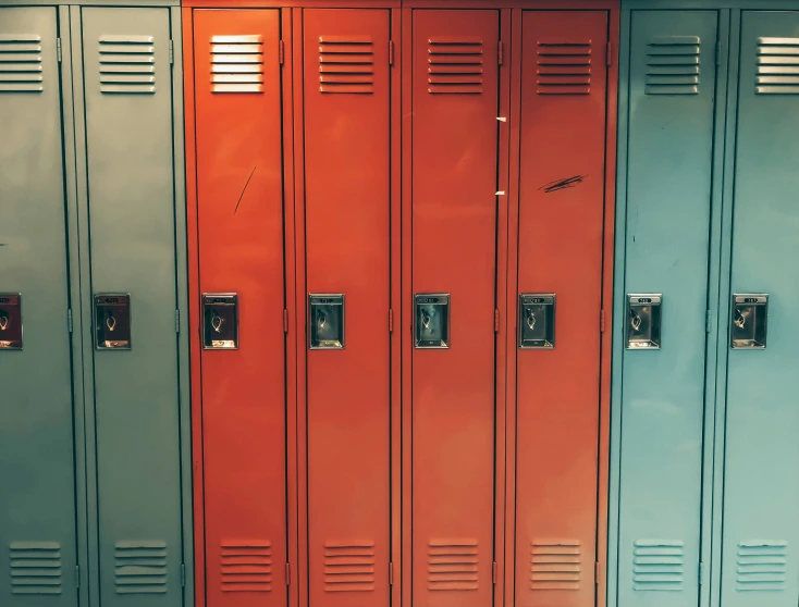 several lockers sit in a row and each has a different color