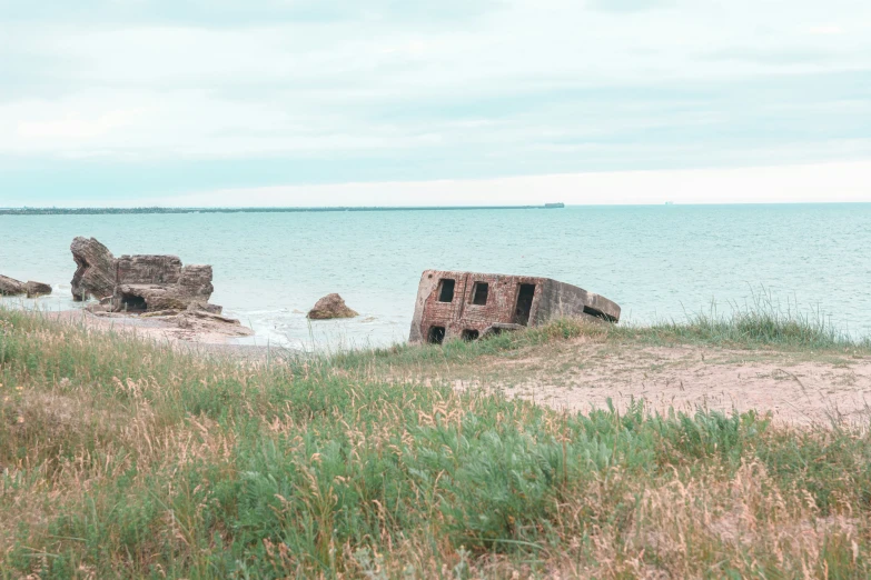 a large rock outcropping by the water