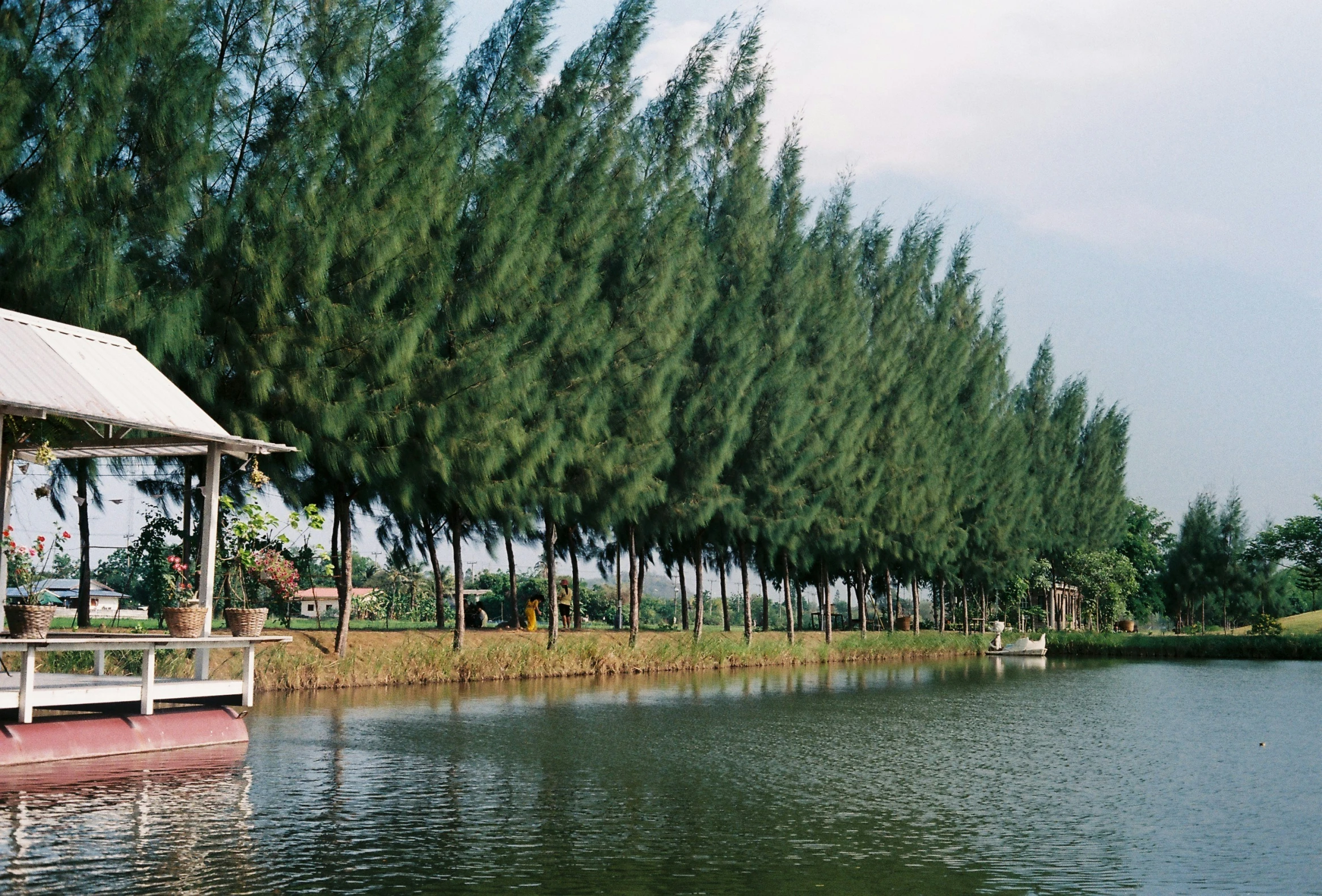 a boat sits in the water on a sunny day