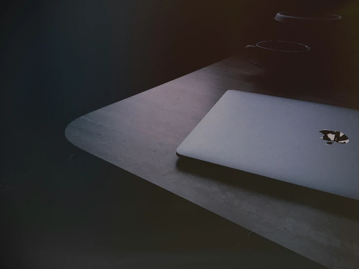 a laptop computer sitting on top of a desk