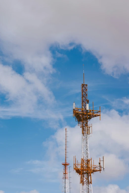 the top of a tall tower with some antennas on it