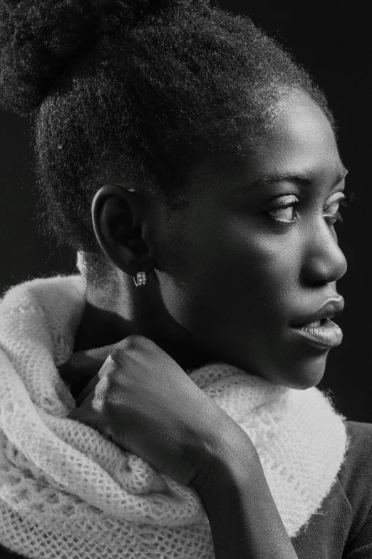 black and white pograph of a woman with a scarf around her neck