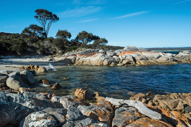 a body of water surrounded by some rocks