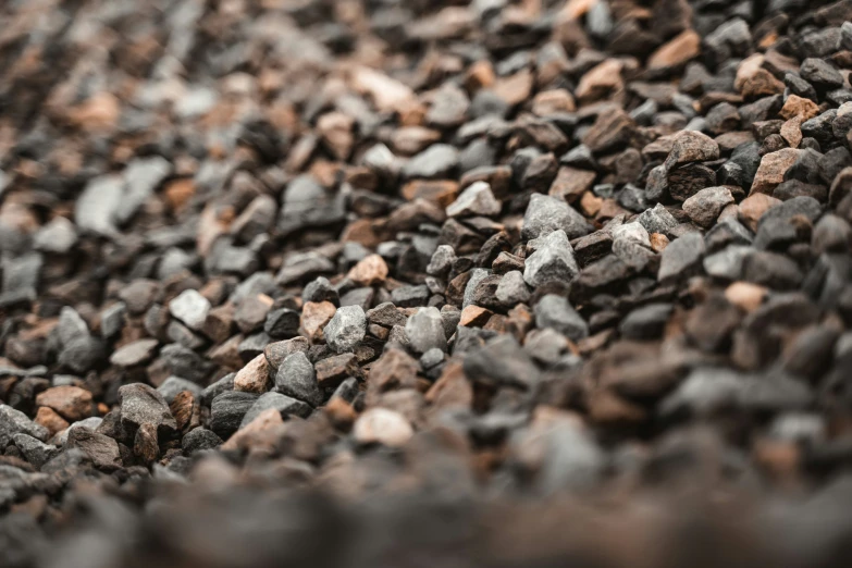 closeup of grey rocks or gravel, and one has small stones