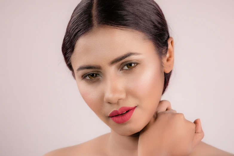 a woman posing for a po while wearing a red lipstick