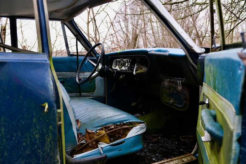 the interior of an old truck is empty
