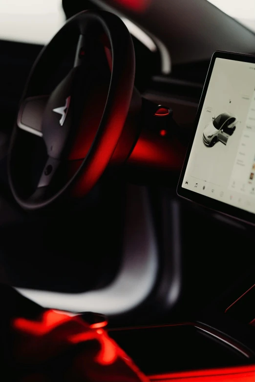 a tablet and steering wheel controls in a car