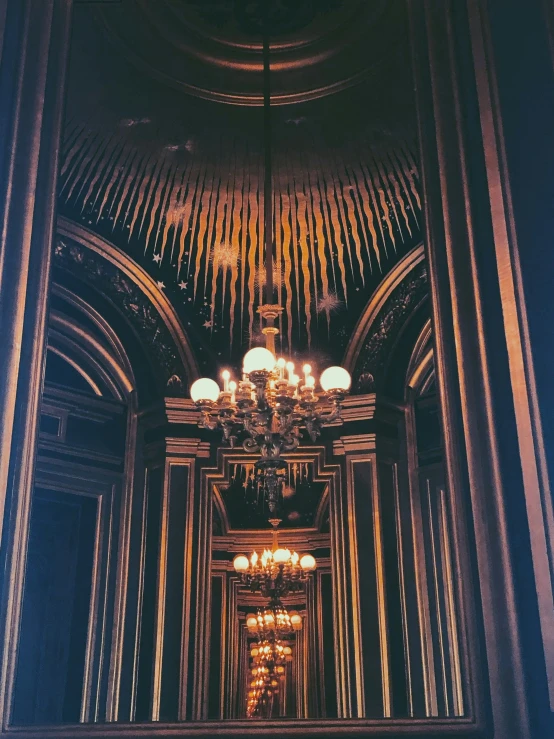 a very long and ornate hallway leading up to the top of the stairs